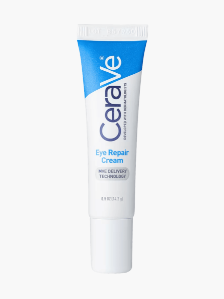 Eye Repair Cream in branded blue and white tube with cap on light gray background